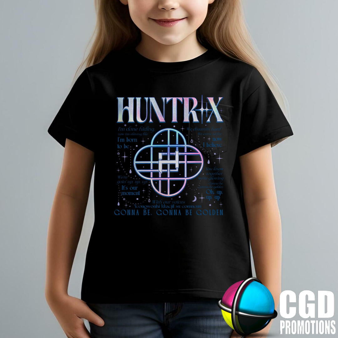 Child wearing a black t-shirt with 'HUNTRIX' design on a gray background
