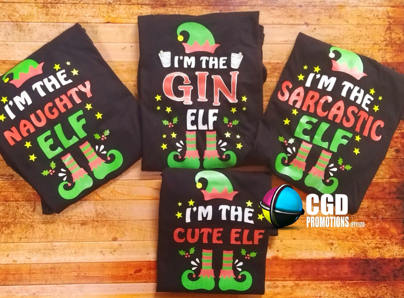 "Custom 'I'm the Elf' Christmas shirts in unisex, ladies' fitted, and kids' sizes, featuring personalized elf titles for each family member on soft, high-quality fabric." I am the sarcastic elf, im the naughty elf, im the cute elf
