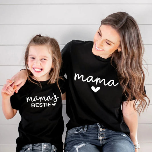 “Mother and child wearing ‘Mama’s Bestie & Mama’ matching t-shirts – unisex, ladies-fitted adult and kids tee set”