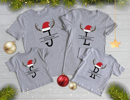 “Family of four wearing personalized Reindeer Monogram Christmas matching family shirts – adult unisex, ladies fitted, and kids tees”

