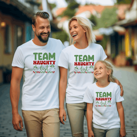 “Family of four wearing Team Naughty List Christmas matching family shirts – adult unisex, ladies fitted, and kids tees”

