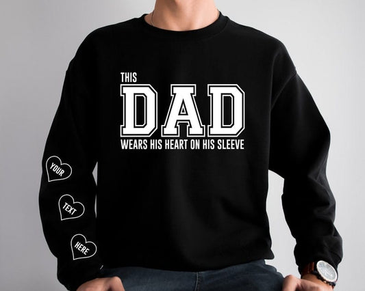 This Dad wears her heart on her sleeve with Children Names on Sleeve Multicolour fonts and hearts Unisex Mother's Day Printed Hoodie / Sweater