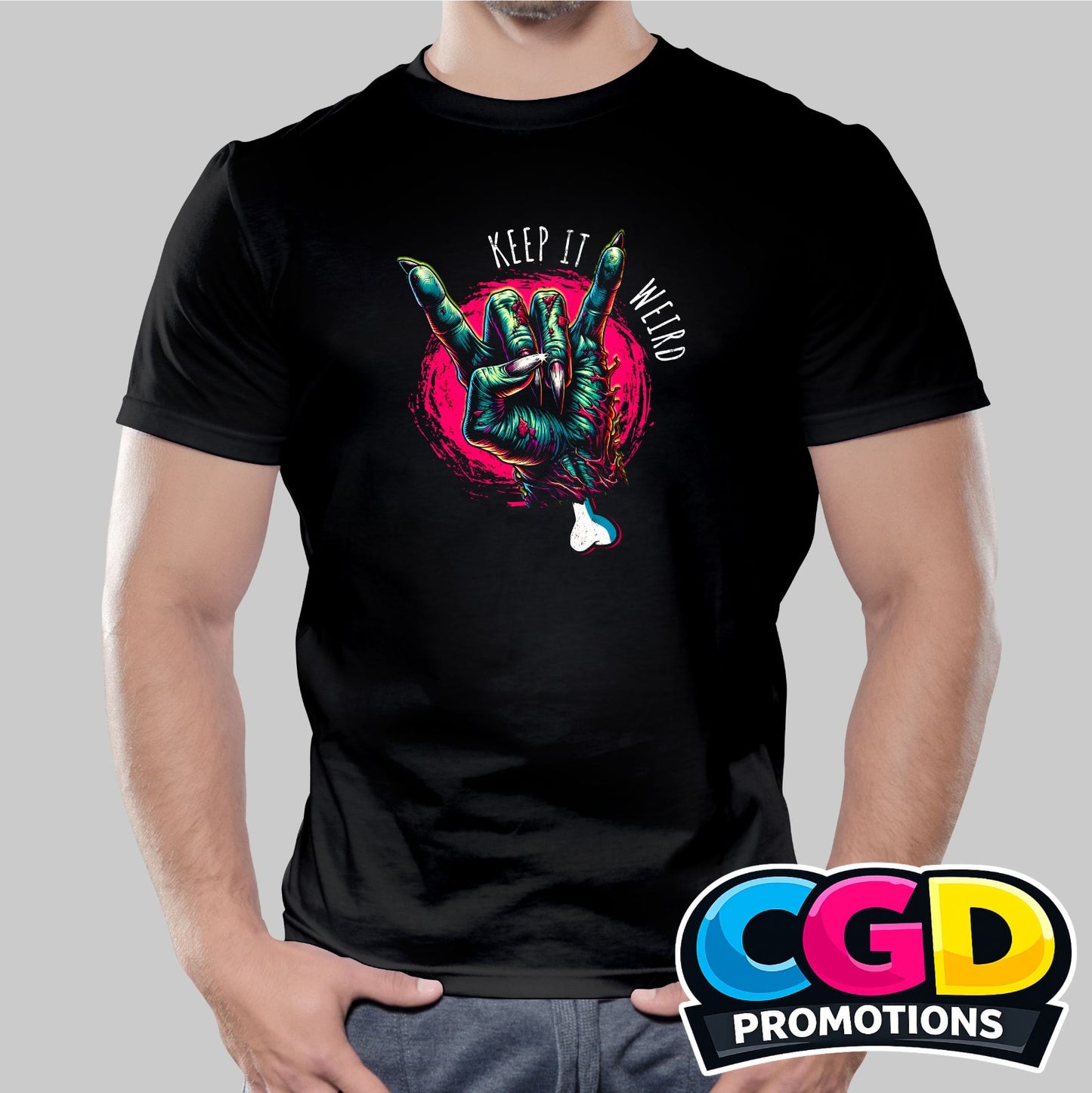 Keep It Weird printed T-shirt featuring a zombie graphic making a heavy metal hand sign
