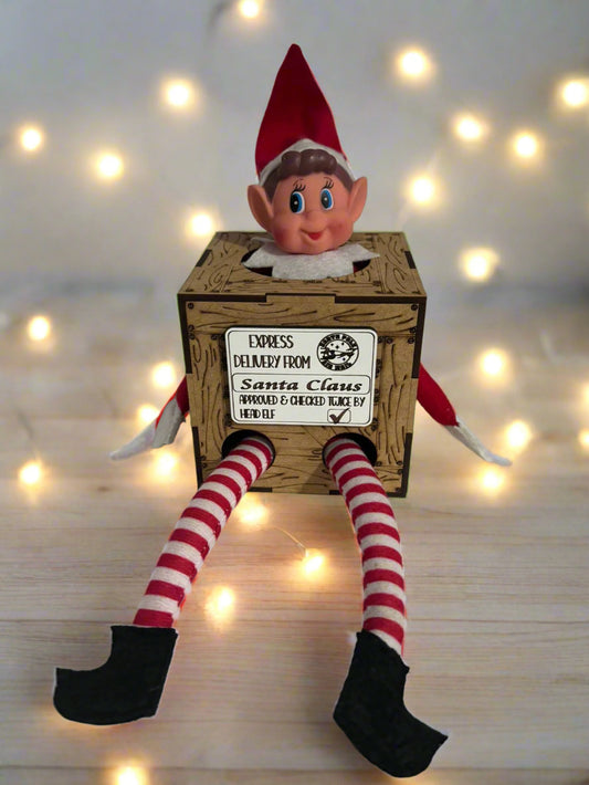 Sibling set of Elf on the Shelf Activity Boxes with two children enjoying festive crafts