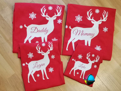 “Family of four wearing matching Christmas white reindeer shirts – unisex adult, ladies fitted, and kids tees”

